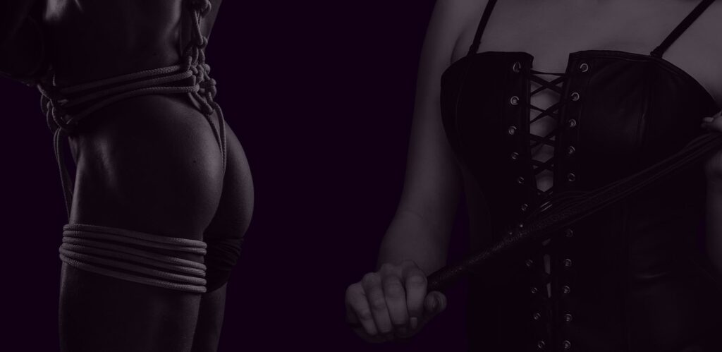 Bodies engaged with rope and leather in a BDSM scene